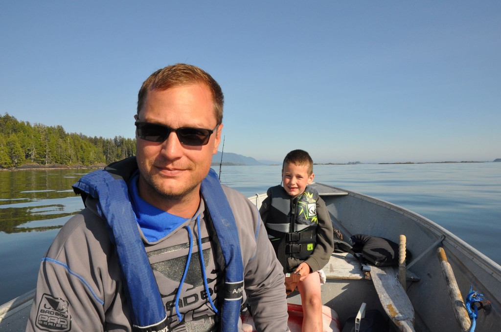 Ryan with his son in a boat.